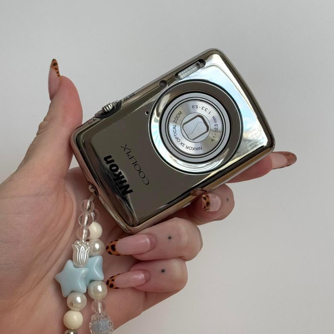 Nikon Coolpix S01 Mini Digital CameraThis ultra...